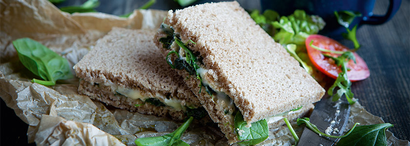 Grilled blue cheese sandwich with spinach leaves and gorgonzola