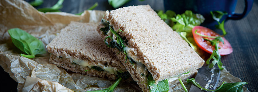 Grilled blue cheese sandwich with spinach leaves and gorgonzola