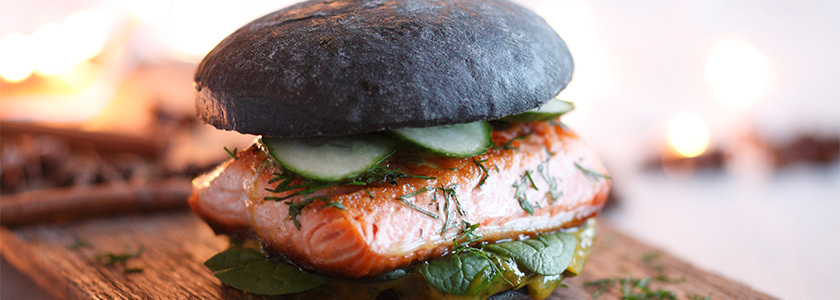 Black burger with salmon steak