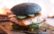 Black burger with salmon steak